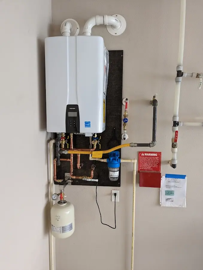 Professional plumber installing copper piping in a Chippewa Falls home